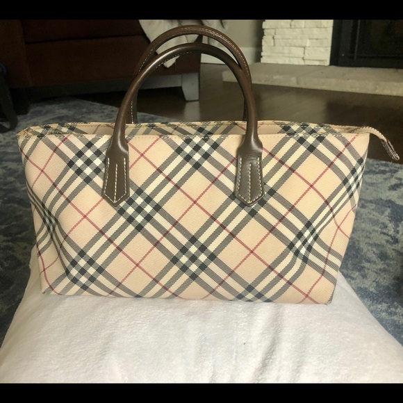 Burberry Handbags - Rare Burberry boat shaped purse, mint condition